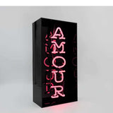 Neon luminoso in vetro "Amour" con box acrilico nero
