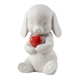 Porcelain sculpture "Buddy – Affectionate puppy" with red heart LLADRÓ